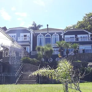 Quarto em Acomodações Particulares Casa Conceito Cacupe, Florianópolis